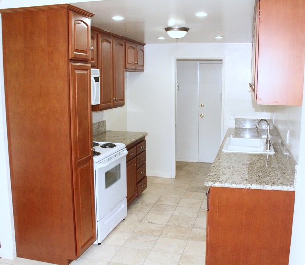 Kitchen with new Custom Cherry wood cabinets, granite and Travertine marble Kitchen with new Custom Cherry wood cabinets, granite and Travertine marble