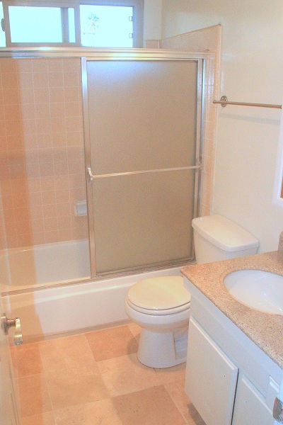Full Bathroom with granite Counters and Marble Floor